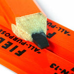 Close-up of Field Notes Carpenter Pencil 3-Pack: fluorescent orange FSC-certified pencils with flat, rectangular black graphite tips, stacked together.