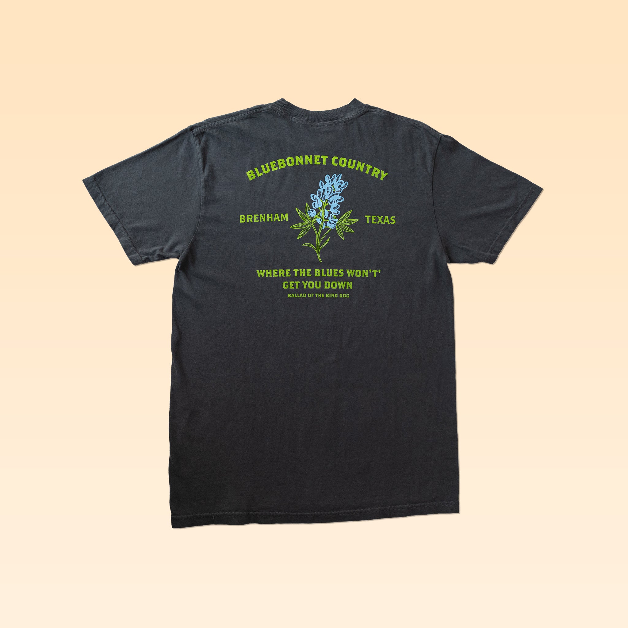 Show your Texas pride in style with the Bluebonnet Country Shirt from Ballad Originals. This black shirt features a bold “Bluebonnet Country Brenham Texas” design and a striking bluebonnet flower graphic printed on the back, along with the phrase “Where the blues won’t get you down.” Crafted with quality construction and a comfortable, everyday fit, it’s the perfect way to celebrate Brenham and Ballad Originals.