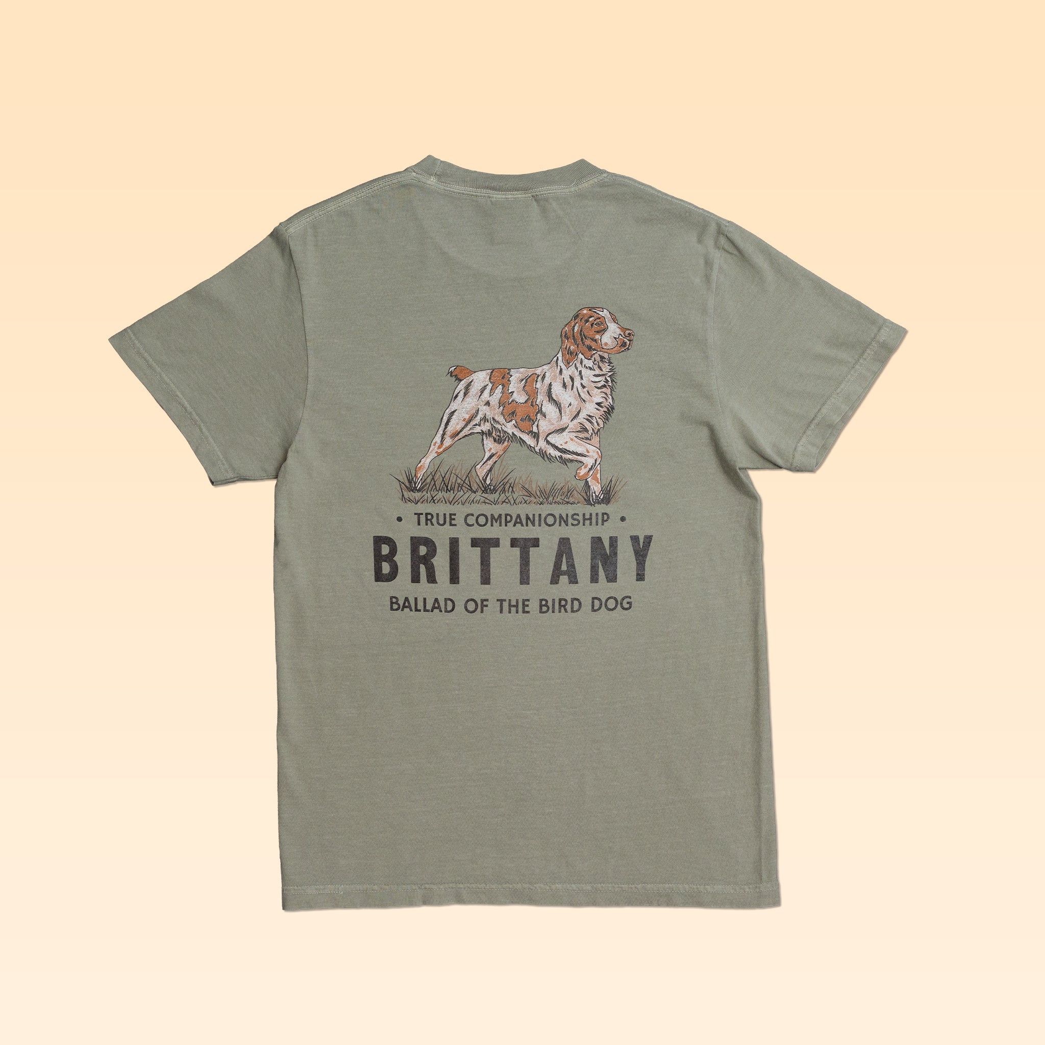 Olive green Bird Dog Series Shirt | Brittany featuring a back graphic of a Brittany spaniel with the text “TRUE COMPANIONSHIP,” “BRITTANY,” and “BALLAD OF THE BIRD DOG.”