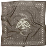The Jenni Earle Bandana | “Feel the Fear, Do It Anyway” is a luxury cotton bandana with a white bird, leaves, and snake graphic, plus geometric borders and small plus signs for an inspirational touch.