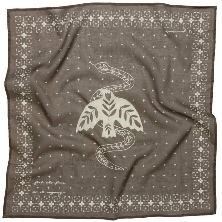 The Jenni Earle Bandana | “Feel the Fear, Do It Anyway” is a luxury cotton bandana with a white bird, leaves, and snake graphic, plus geometric borders and small plus signs for an inspirational touch.