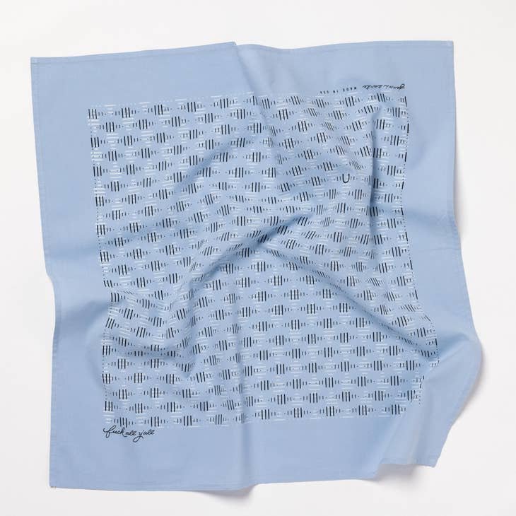 The Jenni Earle "Fuck All Y'All" Bandana is an ethically made, light blue cotton bandana with a pattern of dark blue lines and dots and a signature in one corner, shown laid flat on a white surface.