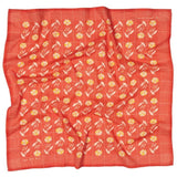 The "Hope Dies Last" square red bandana by Jenni Earle features neat rows of yellow and white flowers with green stems, creating a charming vintage western look—perfect as an inspirational gift.