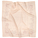 The Jenni Earle “Own Your Power” Bandana features a light pink square with hand drawn snakes, flowers, and geometric patterns in muted brownish-red on luxury cotton fabric. Slightly wrinkled for a handcrafted touch.