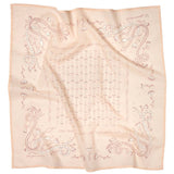 The Jenni Earle “Own Your Power” Bandana features a light pink square with hand drawn snakes, flowers, and geometric patterns in muted brownish-red on luxury cotton fabric. Slightly wrinkled for a handcrafted touch.