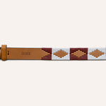The Big Bend by Zilker Belts features Argentine brown leather, a brass buckle, white and maroon geometric hand-stitched patterns, and "ZILKER" embossed on the strap.