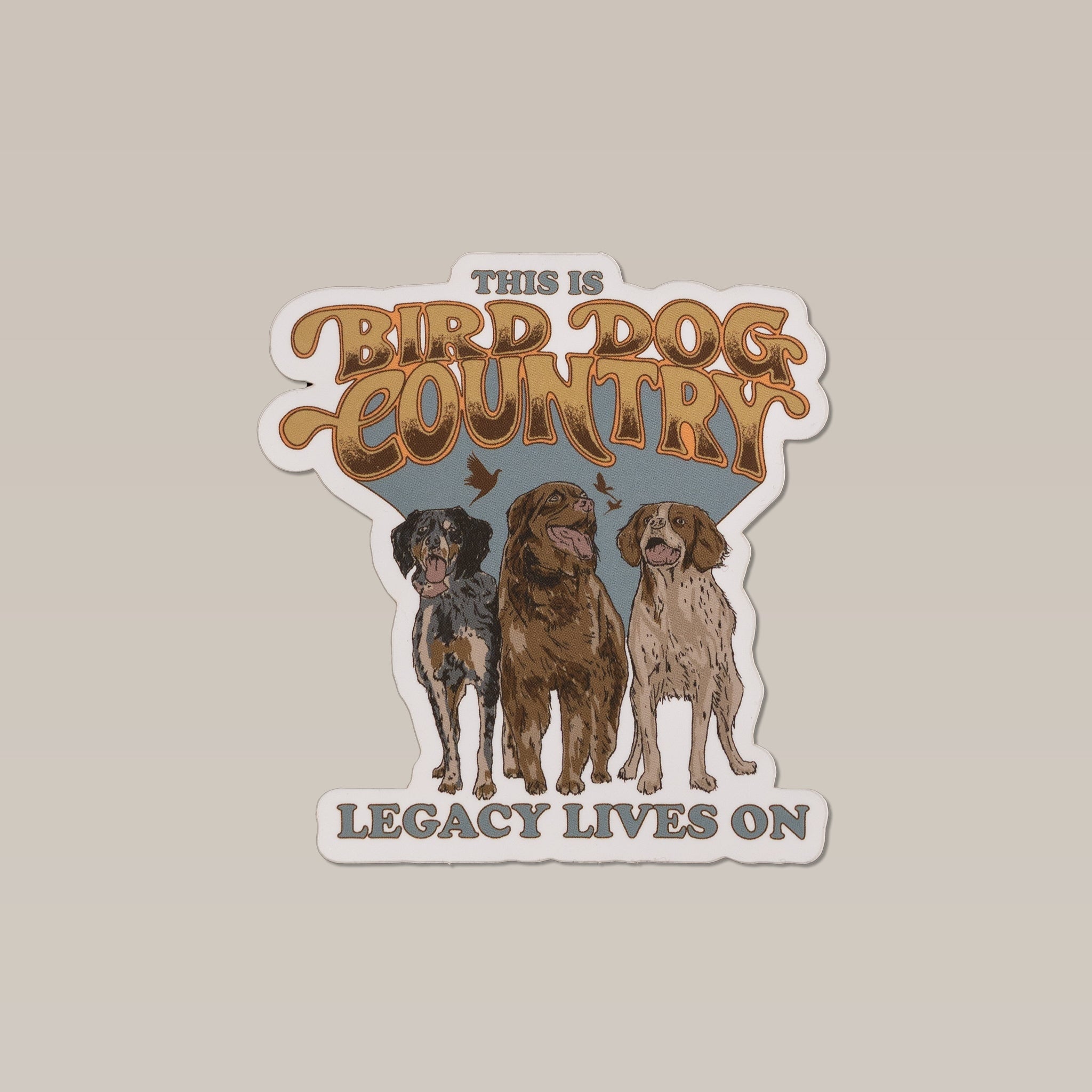 The Ballad of the Bird Dog "Bird Dog Country" shop sticker features "This is Bird Dog Country Legacy Lives On" above and below three dogs side by side, perfect for celebrating bird dog culture.
