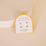 JaxKelly Birthstone Earrings featuring citrine stones on sterling silver posts, displayed on a branded card labeled "Birthstone Collection November Citrine.