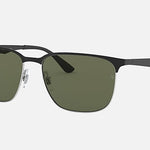 Ray-Ban 3569 sunglasses feature a rectangular black metal frame, green tinted lenses, and adjustable nose pads, designed for performance. Displayed against a plain white background.