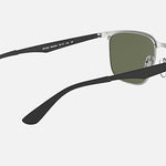 The Ray-Ban 3569 sunglasses feature a metal frame, green lenses, black arms, and clear nose pads. Shown from the rear on a light background, they offer stylish performance eyewear for those who value both fashion and function.