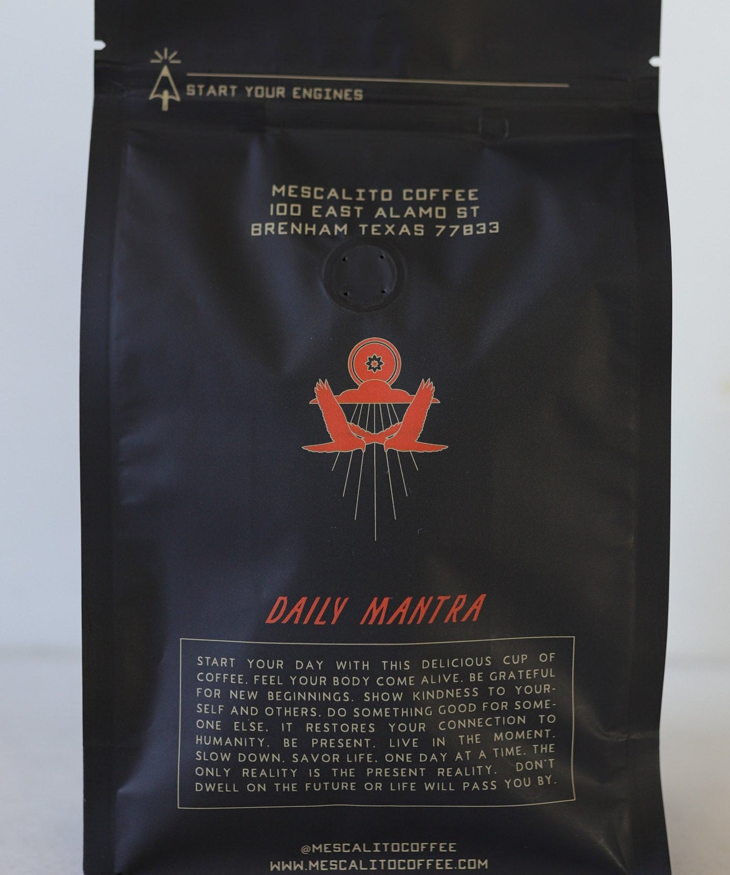 A black “Blend Whole Coffee Beans | Kalimaz” bag from Mescalito Coffee, Brenham, TX, displays a red emblem and description highlighting its Ethiopian Guji Kalimaz beans with extended fermentation.