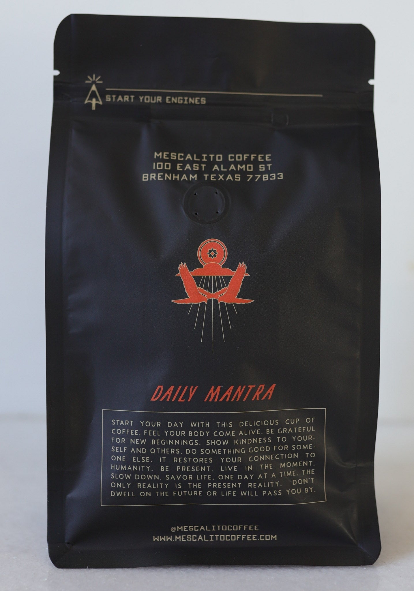 A black “Blend Whole Coffee Beans | Kalimaz” bag from Mescalito Coffee, Brenham, TX, displays a red emblem and description highlighting its Ethiopian Guji Kalimaz beans with extended fermentation.