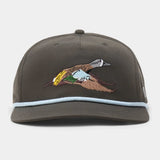 The Duck Camp Blue Winged Teal Hat is a dark brown snapback cap with light blue trim and an embroidered teal on the front. It features an adjustable snapback and durable polyester shell for comfort and style.