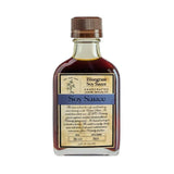 A glass bottle of Bluegrass Soy Sauce Bourbon Barrel Foods by Bourbon Barrel Foods features a brown cap, a blue-accented label, and delivers authentic Kentucky soy sauce with bourbon barrel-aged richness.