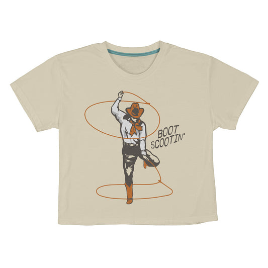 The Boot Scootin' Boxy Tee by Sendero Provisions Co. is a beige shirt with a graphic of a cowboy in Western wear dancing amid rope loops and the text "Boot Scootin’.