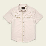 The Howler Brothers Broncbuster Snapshirt is a short-sleeve, light beige western shirt featuring decorative chest stitching, a collar, and classic pearl snap buttons, shown on a plain background.