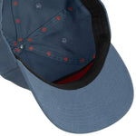The image shows the inside of the Burro Lady Hat by Sendero Provisions Co.—a blue 5-panel cotton twill cap with a black inner rim, red stitching, and a snapback closure.