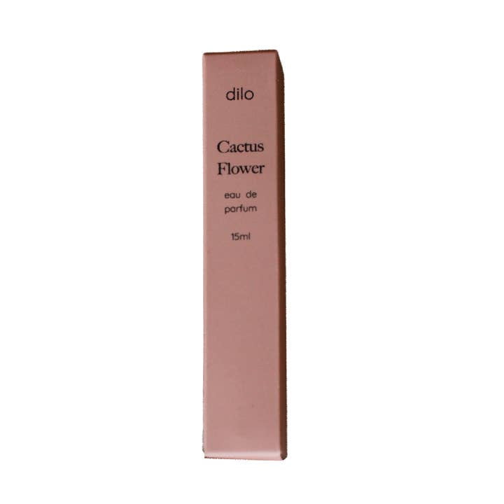 A rectangular pink box labeled "Cactus Flower Eau De Parfum | dilo" stands upright against a white background, suggesting the fresh cactus flower and delicate jasmine scents inside.