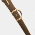 The Duck Camp Canvas Gun Sleeve, in brown and tan waxed canvas, features padding, a handle, and secure strap closure for firearm protection. It’s pictured lying flat on a white background.
