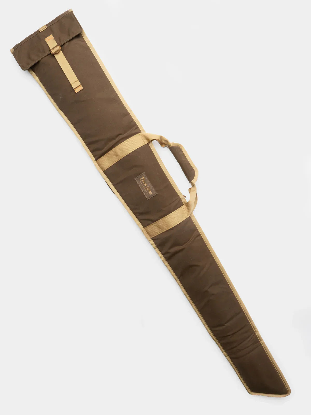 The Duck Camp Canvas Gun Sleeve is a brown and tan waxed cotton case with a handle, designed for carrying and protecting your rifle or similar long items.