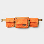 The Duck Camp Canvas Shell & Game Bag is an orange and tan waxed canvas utility belt bag with three pouches, adjustable straps, and plastic buckles—ideal for carrying your essentials. Shown on a plain white background.