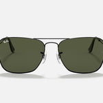 Front view of Ray-Ban Caravan sunglasses in gunmetal with green lenses, shown on a plain white background.