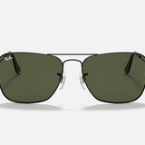 A pair of Ray-Ban Caravan square sunglasses in gunmetal with green lenses.