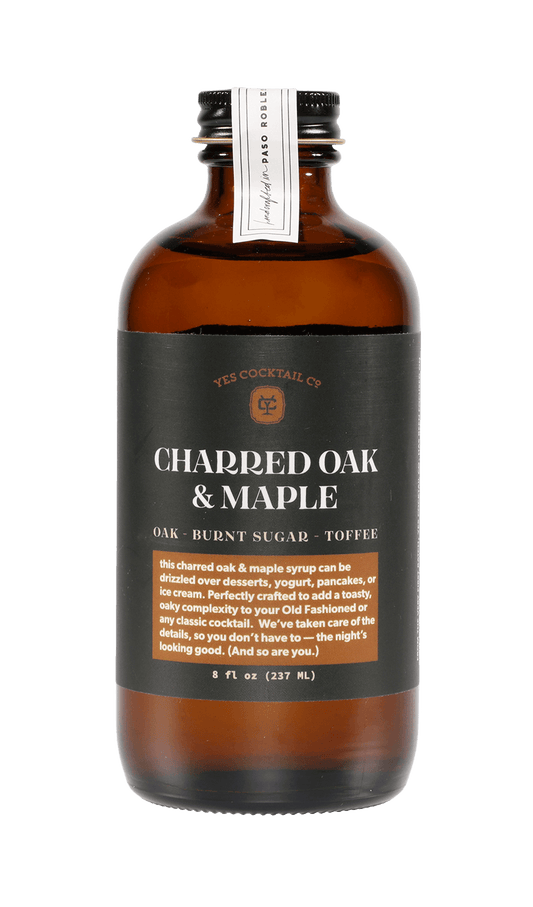 A brown glass bottle of Charred Oak & Maple cocktail syrup by Yes Cocktail Co., 8 fl oz (237 mL), offers rich oak, burnt sugar, and toffee notes—crafted as a robust Charred Oak Maple Syrup.