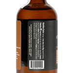 A brown glass bottle from Yes Cocktail Co. with a black label featuring nutritional facts, a barcode, and a tamper-evident seal—ideal for holding rich Charred Oak & Maple syrup.