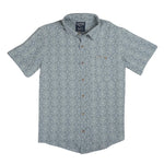 The City Slicker | Arizola Chevron from Sendero Provisions Co. is a light blue, short-sleeve, button-up shirt with a subtle geometric pattern, front chest pocket, and small label above the pocket.
