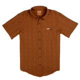 The City Slicker | Arizola Chevron by Sendero Provisions Co. is a short-sleeve, button-up shirt in burnt orange with a subtle chevron pattern, chest pocket, and collar—ideal for capturing cool desert vibes.