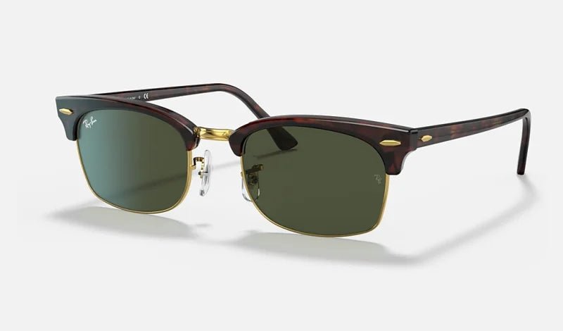 The Ray-Ban 3916 Clubmaster Square sunglasses feature dark green lenses, a tortoiseshell browline frame with gold accents, and slim temples—ideal for enhancing modern style—displayed against a plain light background.
