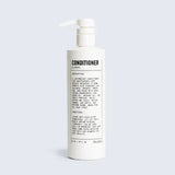 White pump bottle labeled "Conditioner | Blu Atlas" by Blu Atlas, with product description and instructions in black text. This lightweight conditioner moisturizes hair with argan oil, leaving it soft and manageable.