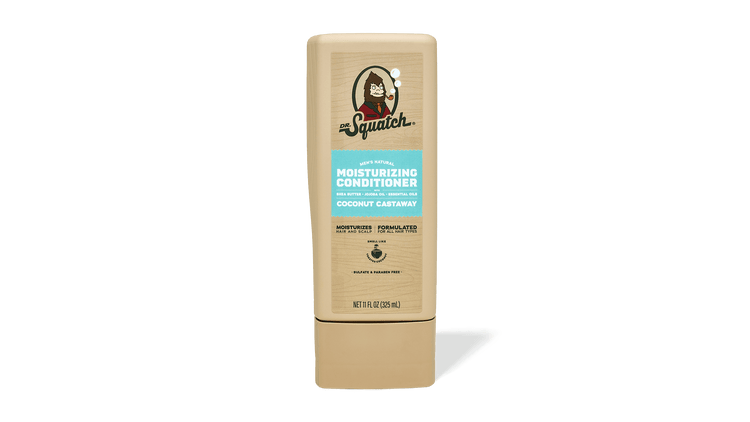 A tan plastic bottle of Dr. Squatch Conditioner | Coconut Castaway with avocado oil, blue label, and upright cap stands against a plain white background.