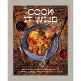 The cover of "Cook it Wild" by Penguin shows a plate of pasta with tomatoes, herbs, and bread on an outdoor surface—ideal inspiration for easy camp cooking and outdoor meals.