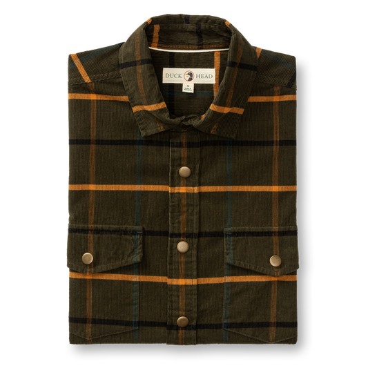 The Duck Head Corduroy Plaid Snap Shirt features green cotton corduroy with an orange and black plaid pattern, metal snap buttons, two front pockets, and classic workwear style.