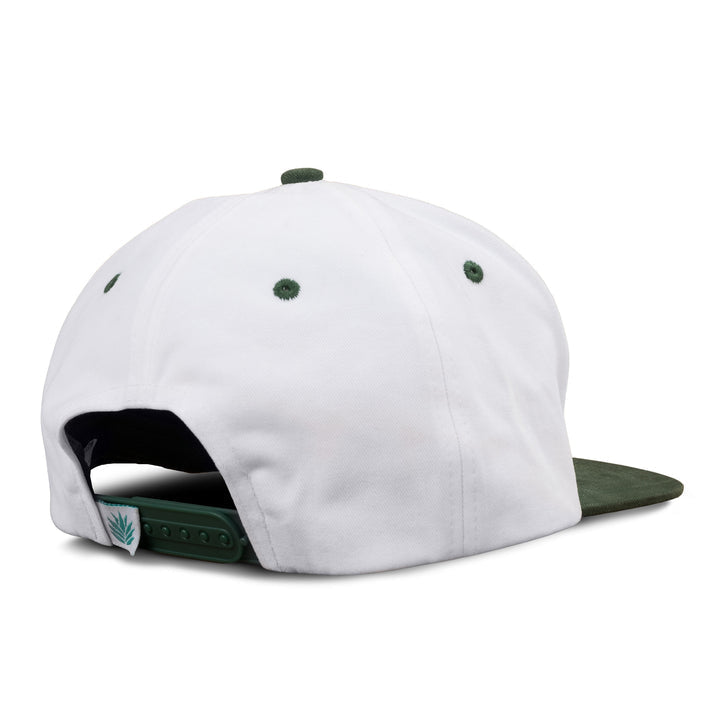 The Cowboys Don't Cry Hat by Sendero Provisions Co. is shown from the back, featuring a white crown, green eyelets and brim, plus an adjustable snapback—ideal for those who love classic Western style.