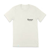 The Cowboys Don't Cry Pocket T-Shirt by Sendero Provisions Co. is a plain white organic cotton tee with a chest pocket featuring black "COWBOYS DON'T CRY" text and a soft touch screen print.