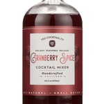 A 16 fl oz (473 ml) glass bottle of red liquid labeled "Cranberry Spice" by Yes Cocktail Co., featuring holiday cocktail mixer seasonal release branding.