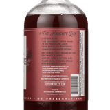 A glass bottle of Cranberry Spice by Yes Cocktail Co. features a label with cocktail recipe instructions and a barcode on the back.