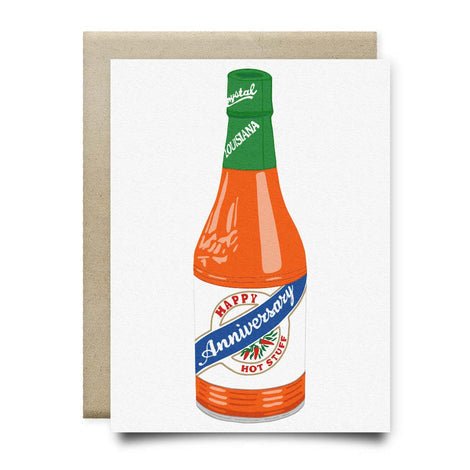 The Crystal Happy Anniversary Hot Stuff Card by Anvil Cards features a Louisiana hot sauce bottle illustration with "Happy Anniversary Hot Stuff" on luxe linen paper. This A2 card is blank inside for your message.