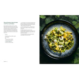 A plate of shaved summer squash salad with pesto and pepitas sits beside an open copy of "Cured" by Penguin, inspiring charcuterie fans and creative food preservation enthusiasts.