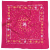 The “Heritage Cotton Bandana - ‘for Goodness Sake’” by Jenni Earle features a bold red cotton fabric adorned with intricate, symmetrical yellow and white floral and vine patterns—perfect for styling as a western neckerchief or giving as an uplifting encouragement gift.