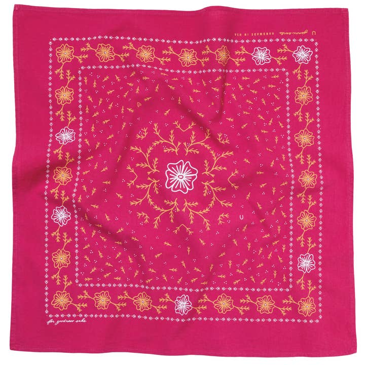 The “Heritage Cotton Bandana - ‘for Goodness Sake’” by Jenni Earle features a bold red cotton fabric adorned with intricate, symmetrical yellow and white floral and vine patterns—perfect for styling as a western neckerchief or giving as an uplifting encouragement gift.