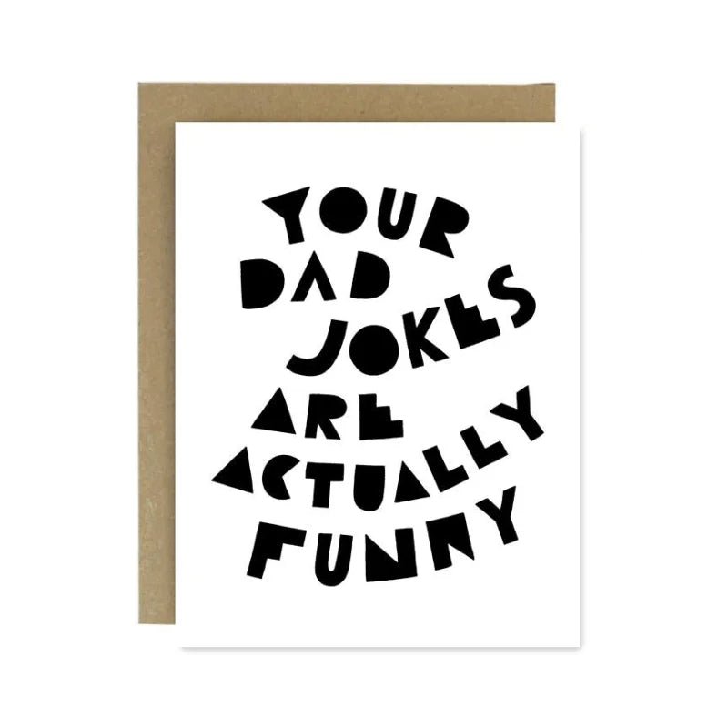 The Dad Jokes Father's Day Card by Worthwhile Paper features bold black text on recycled paper—“Your dad jokes are actually funny”—and comes with a brown envelope. The card is blank inside for your personal message.