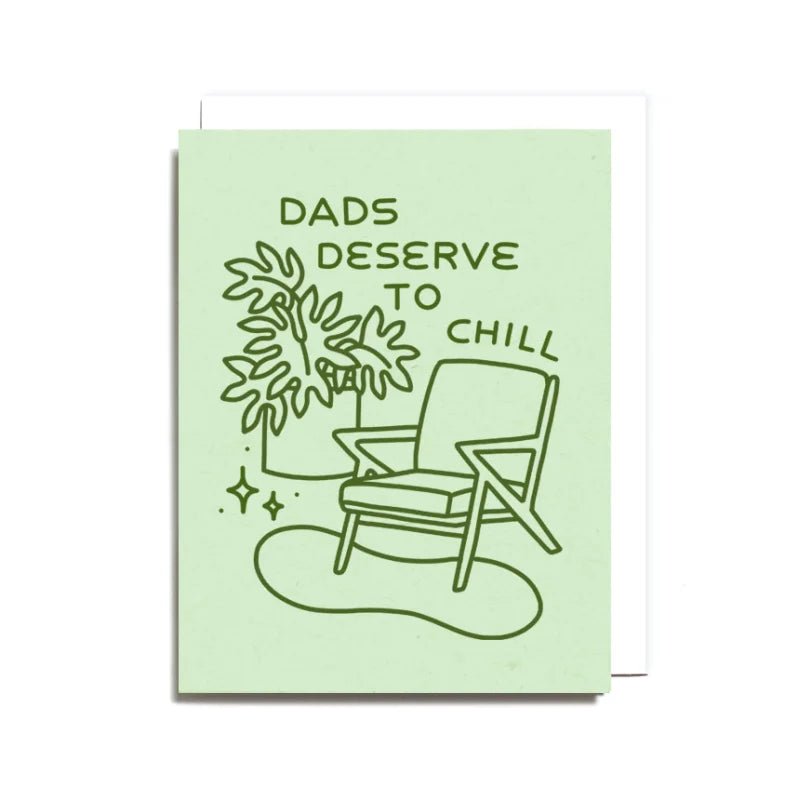 The Dads Deserve to Chill Card by Worthwhile Paper features a chair, plant, and "Dads deserve to chill" text on light green. Printed on recycled paper and blank inside for your own message.