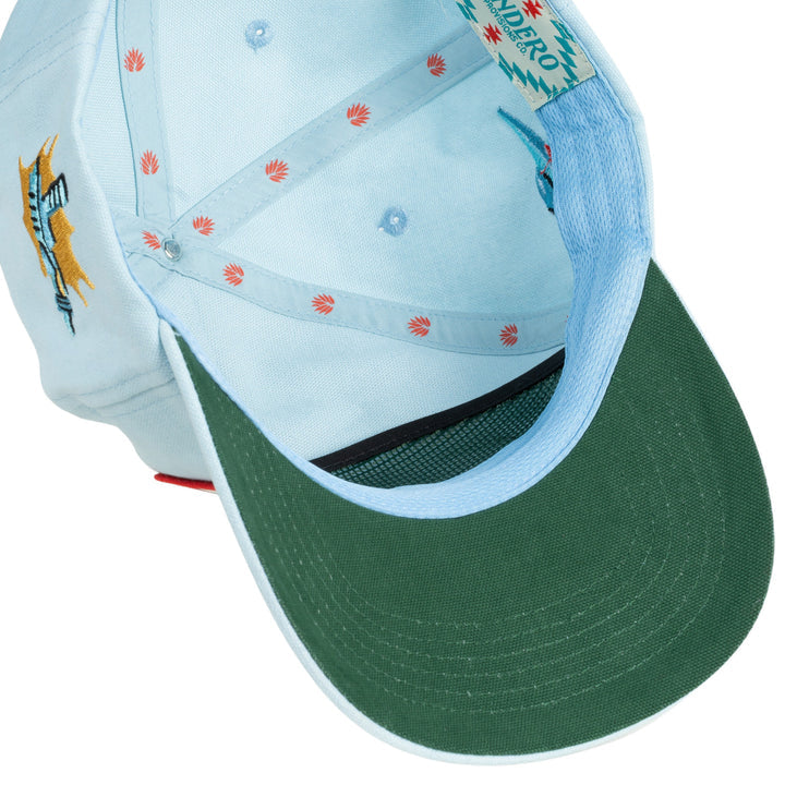 The Danger Cowboy Hat from Sendero Provisions Co. is shown from underneath, featuring a green brim underside, inner red leaf pattern, and detailed stitching—your perfect laser-proof companion from Sendero Provisions Co. on every Galactic West journey.