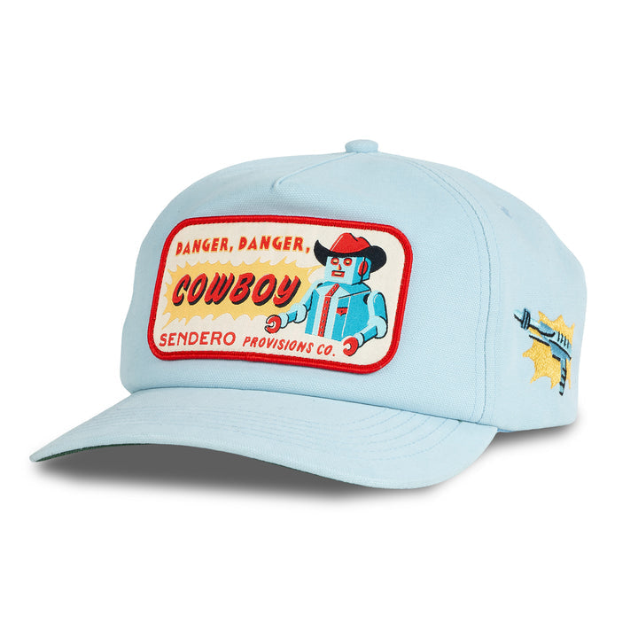 Light blue "Danger Cowboy Hat" by Sendero Provisions Co. features a robot cowboy patch with "Danger, Danger, Cowboy Sendero Provisions Co." text and a ray gun graphic on the side—ideal for Galactic West adventures or asteroid belt crossings.