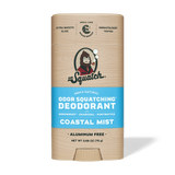 A stick of Dr. Squatch Deodorant | Coastal Mist features an ocean breeze scent, a tan and blue label, is aluminum free, dermatologist tested, and made with charcoal powder.