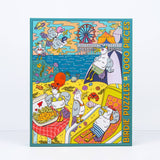 Colorful 1000-piece jigsaw puzzle by Birdie Puzzles, titled "Gull Trouble," features quirky cartoon birds at the beach with a ferris wheel, boardwalk, and ocean. Made from recycled materials, this fun puzzle is perfect for bird lovers.